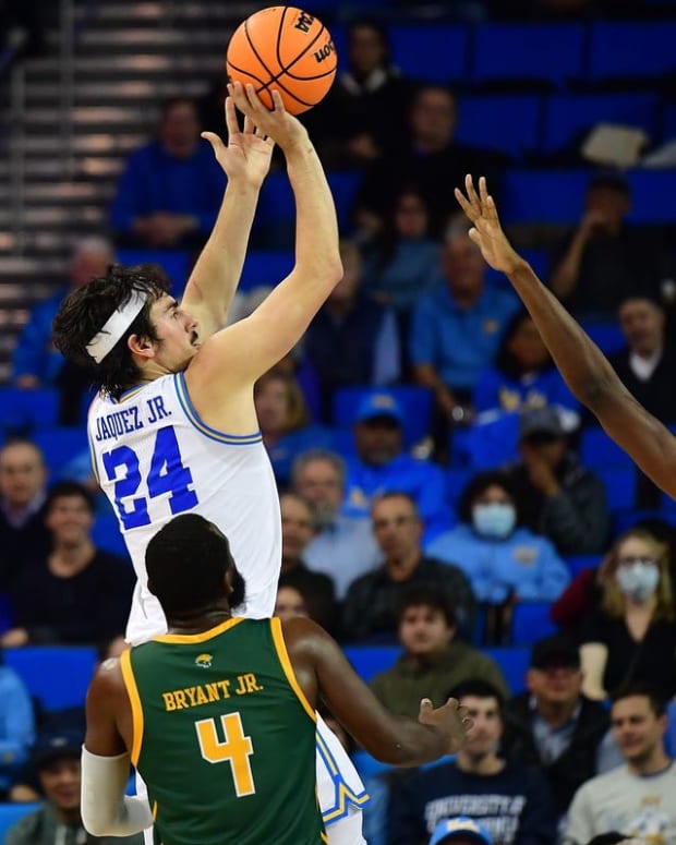 Nov 14, 2022; Los Angeles, California, USA; UCLA Bruins guard Jaime Jaquez Jr. (24) shoots against Norfolk State Spartans forward Kris Bankston (30) and guard Joe Bryant Jr. (4) during the second half at Pauley Pavilion. Mandatory Credit: Gary A. Vasquez-USA TODAY Sports